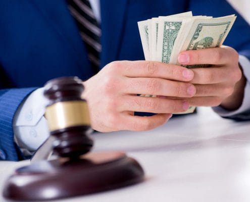 Lawyer distributes money awarded in a personal injury settlement in Florida