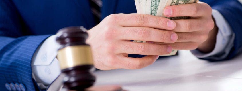 Lawyer distributes money awarded in a personal injury settlement in Florida